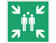 Grön nödskylt med symbol för evakueringspunkt